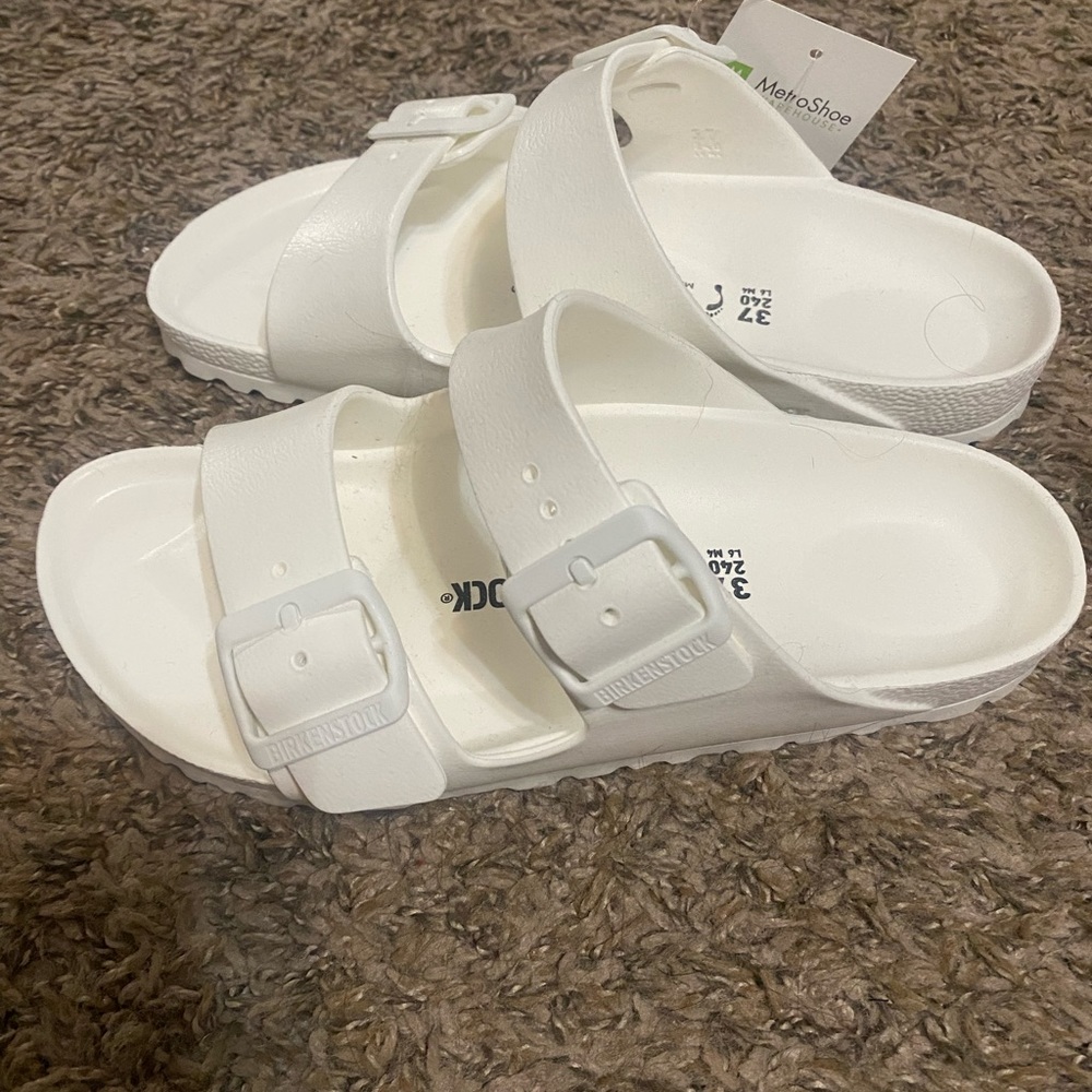 White Birkenstock slides, brand new with tags. Size 37, which is a size 7.